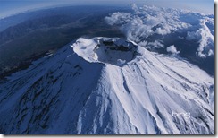 A aerial, wide-angle view of Mt. Fuji's crater