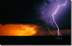 Daytime cloud to ground lightning flashes with three branches to the ground in Texas